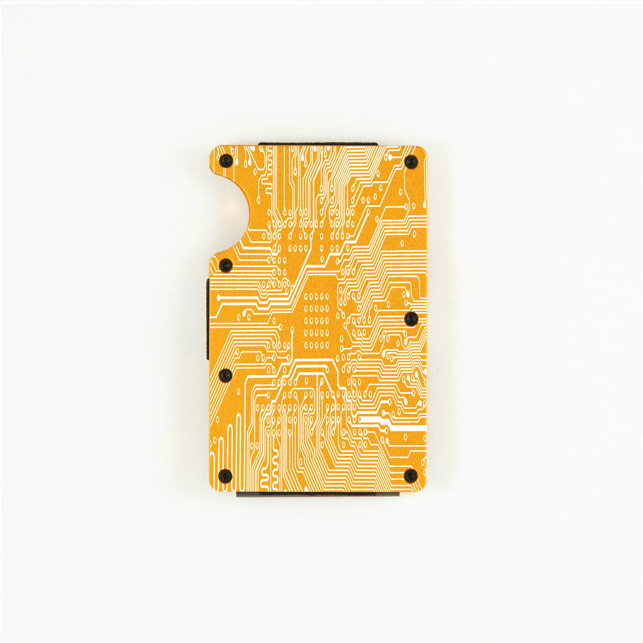 RFID-shielding orange aluminum wallet with engraved circuit board design.