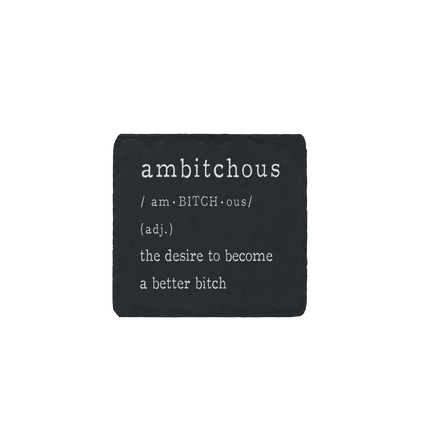 Slate coaster engraved with the word “ambitchous” and its definition: the desire to become a better bitch