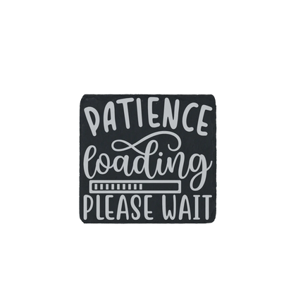 Laser-engraved slate coaster with the phrase “Patience loading… please wait”