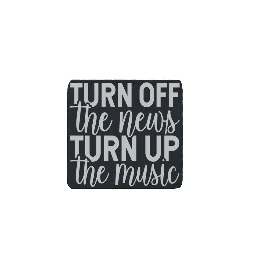Slate coaster with the quote “Turn off the news, turn up the music” engraved.