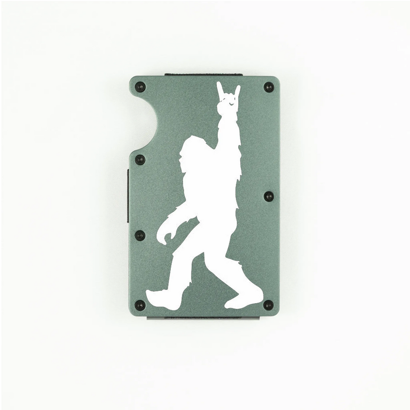 Dark grey aluminum RFID wallet with engraved Bigfoot doing rock on hand gesture