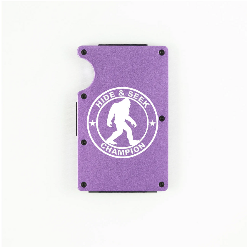 Purple aluminum RFID wallet with engraved Hide and Seek Champion Bigfoot badge