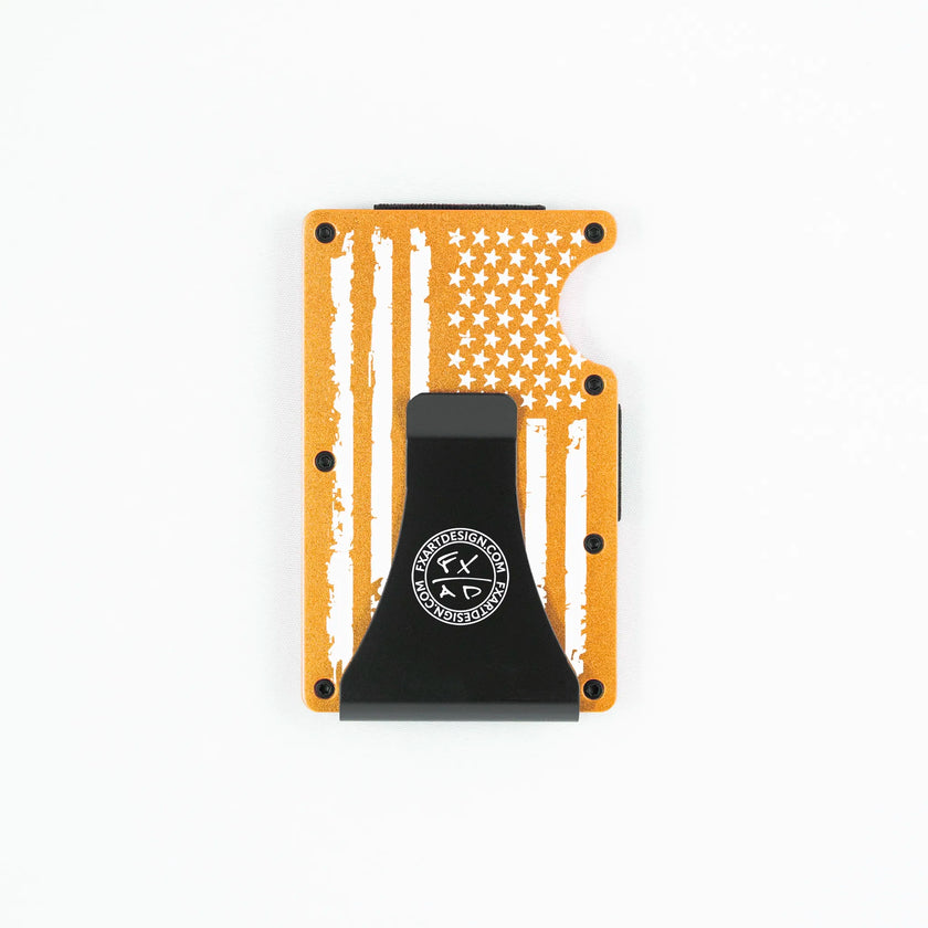 Back view of orange metal RFID wallet with distressed American flag engraving and Fraxure Art & Design money clip