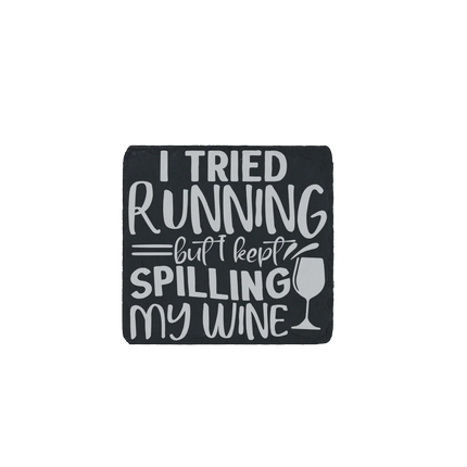 Slate coaster engraved with “I Tried Running But Kept Spilling My Wine” – humorous wine quote gift for runners and wine lovers.