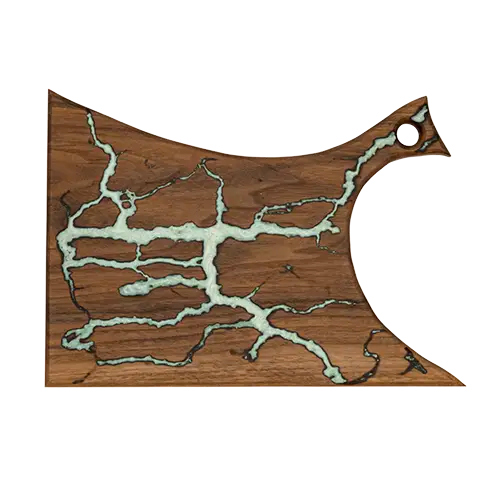 Walnut charcuterie board with a tapered handle, inlaid with ghost-green epoxy fractal veins.