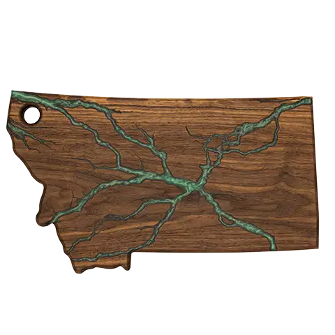 Montana-shaped walnut charcuterie board with green epoxy fractal inlay.